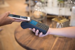 Contactless EFTPOS hire terminal in use at a market stall